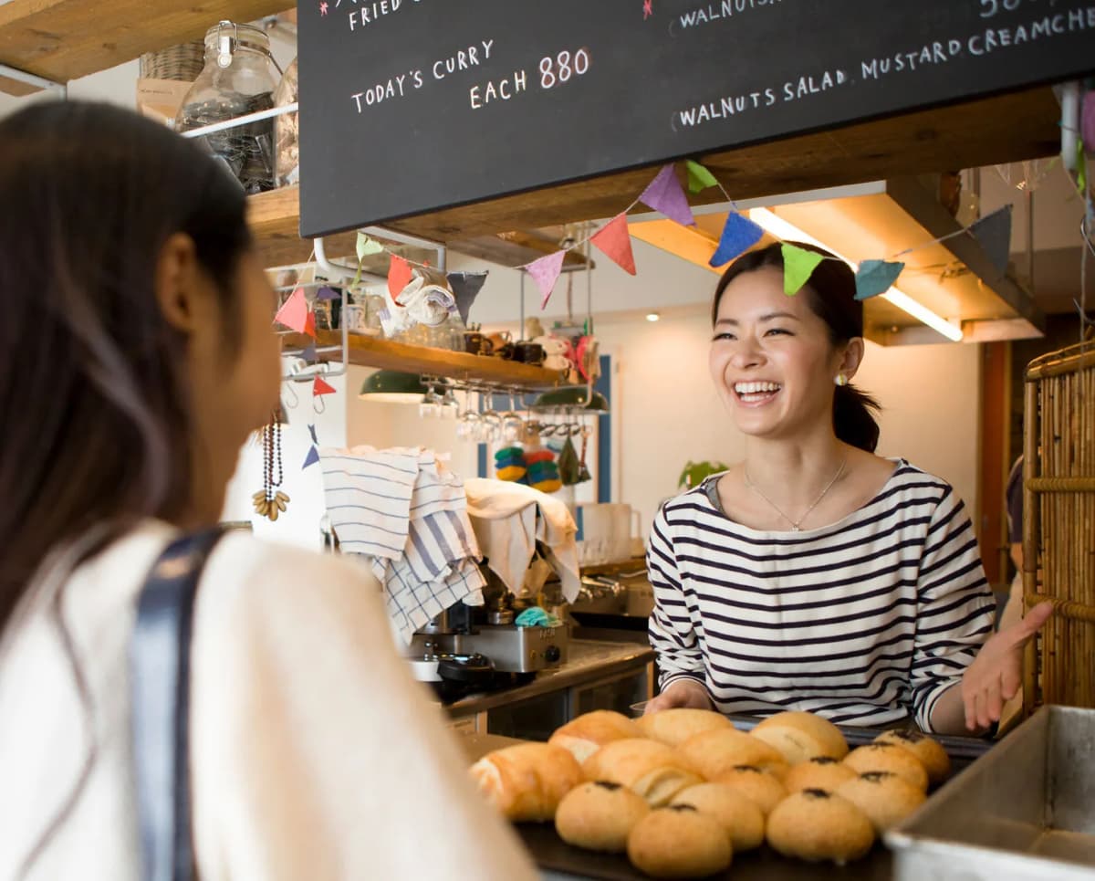 Happy merchant using Bird